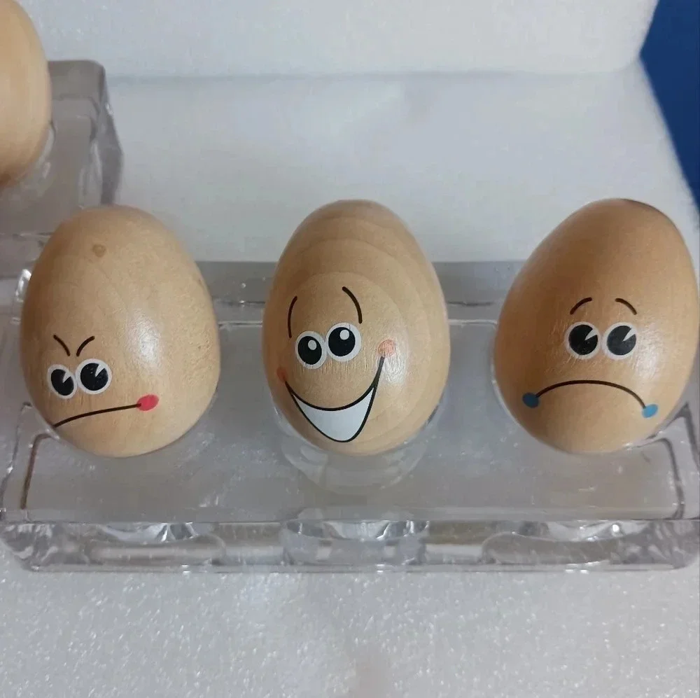 Chicken eggspression faces on wooden background set of 6